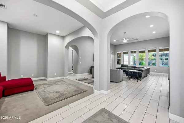 a view of a backyard with swimming pool