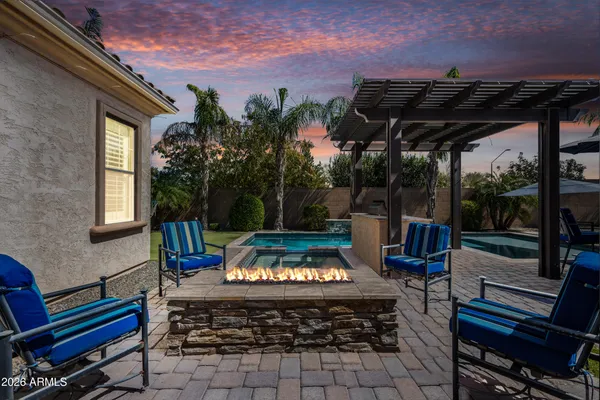 a spacious bathroom with a tub a sink and a large mirror