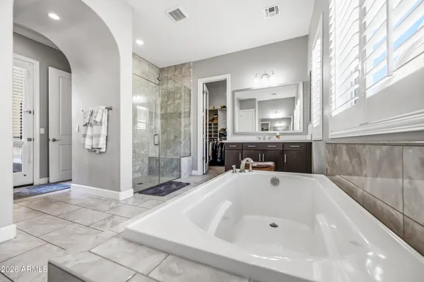 a bedroom with a bed and a closet