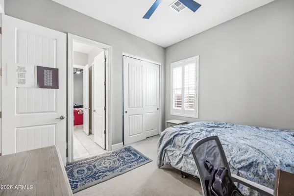 a bathroom with a shower sink vanity mirror and toilet