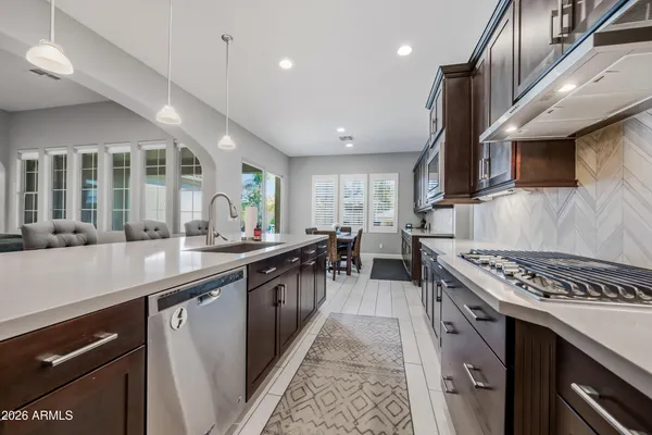 a living room with furniture ceiling fan and a rug