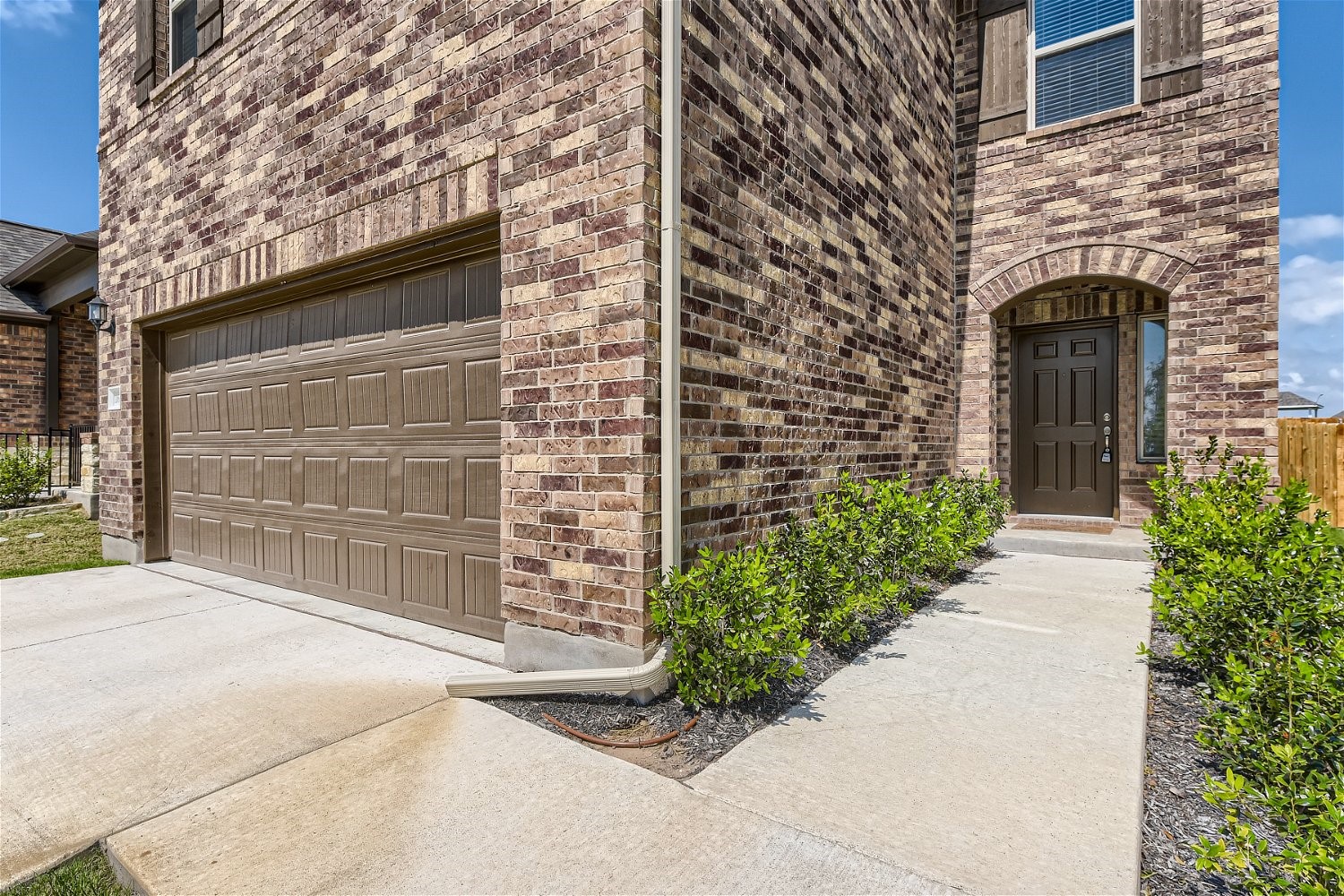 11612 Caithness Way Austin, TX 78754 - Photo 2 of 11 a front view of a house with a yard
