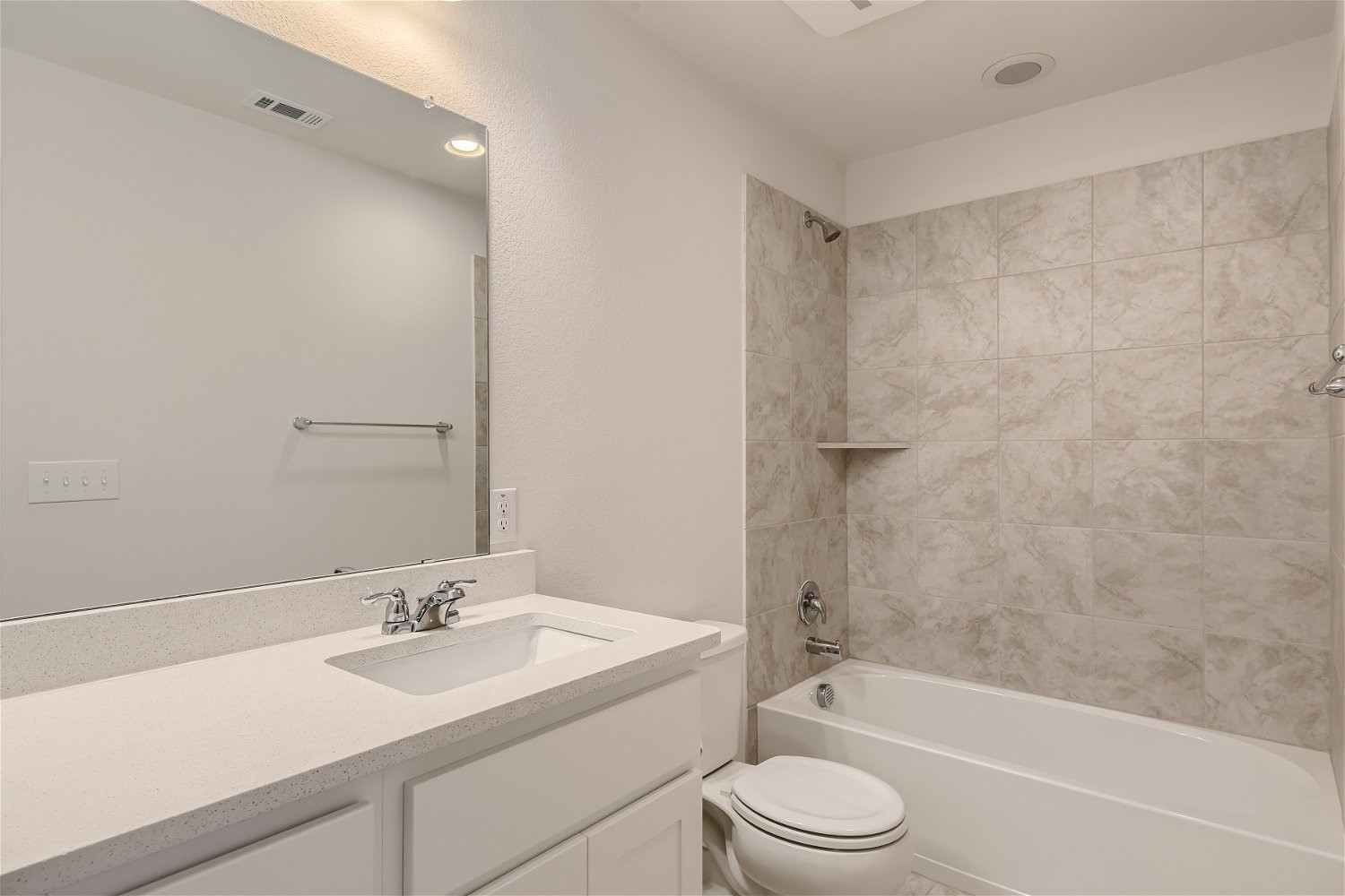 11612 Caithness Way Austin, TX 78754 - Photo 9 of 11 a bathroom with a toilet a sink a mirror a bathtub and vanity