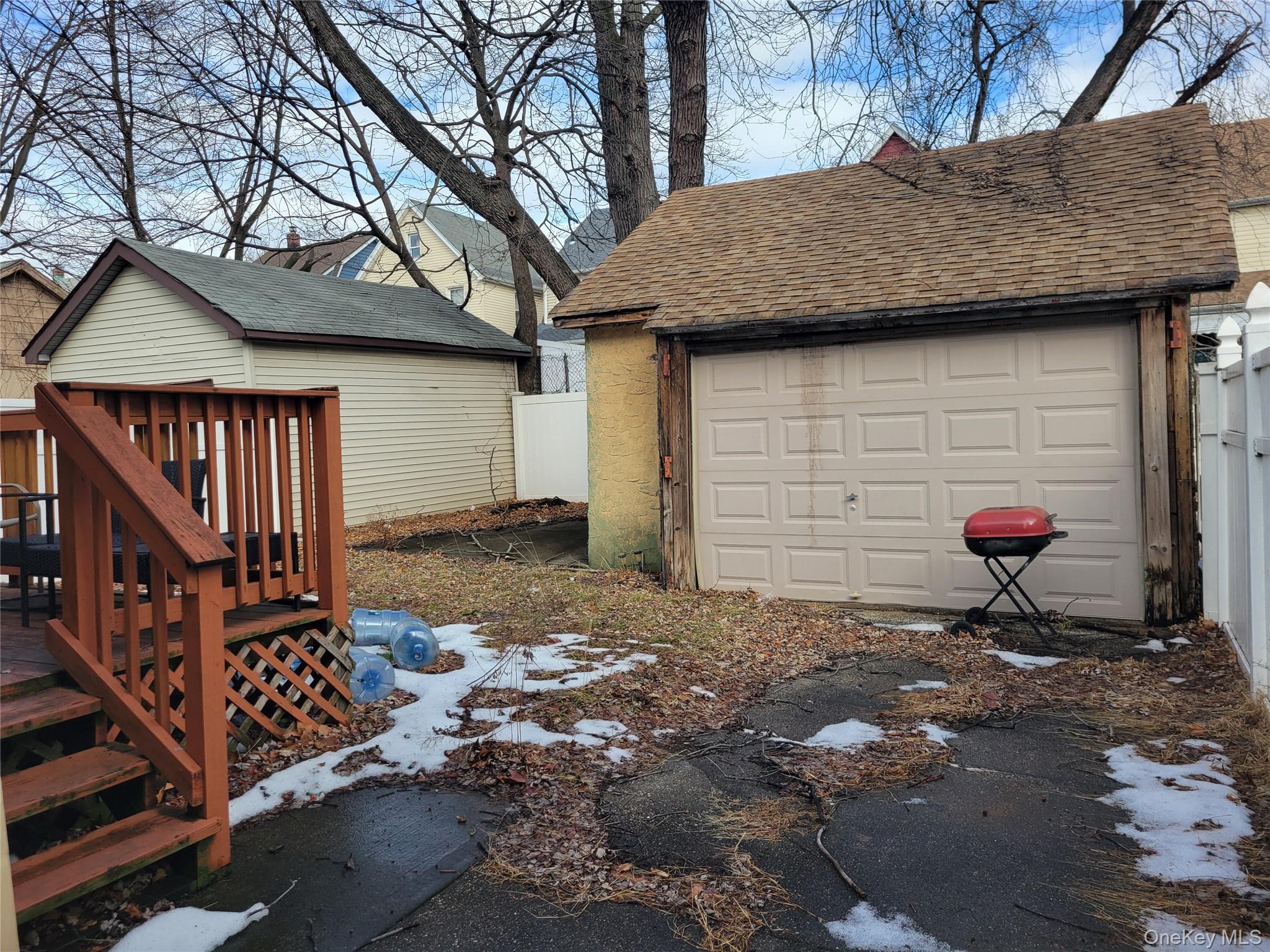 214-19 112th Road Queens, NY 11429 - Photo 17 of 19 a backyard of a house with seating space