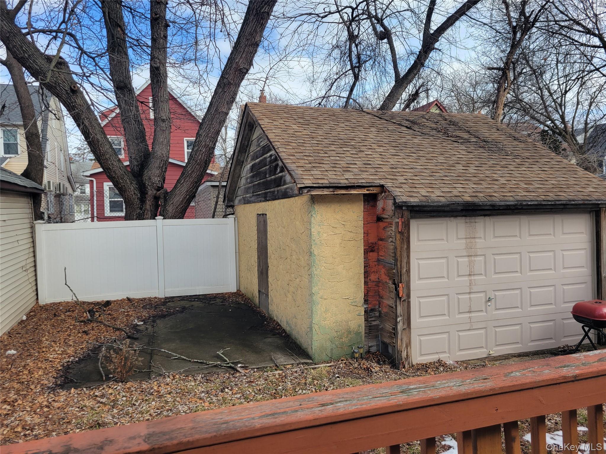 214-19 112th Road Queens, NY 11429 - Photo 19 of 19 a view of a house with a large tree