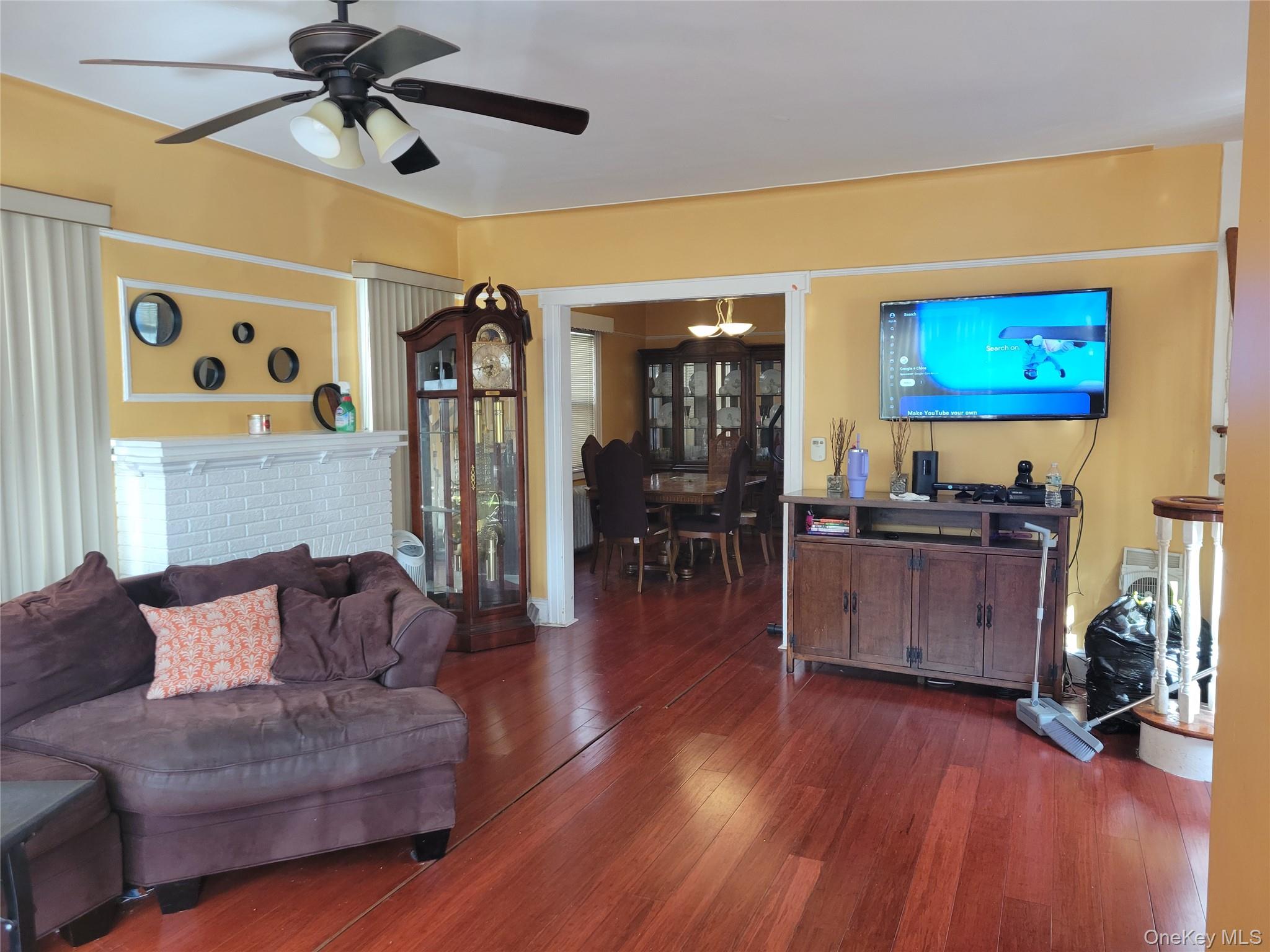 214-19 112th Road Queens, NY 11429 - Photo 3 of 19 a living room with furniture and wooden floor