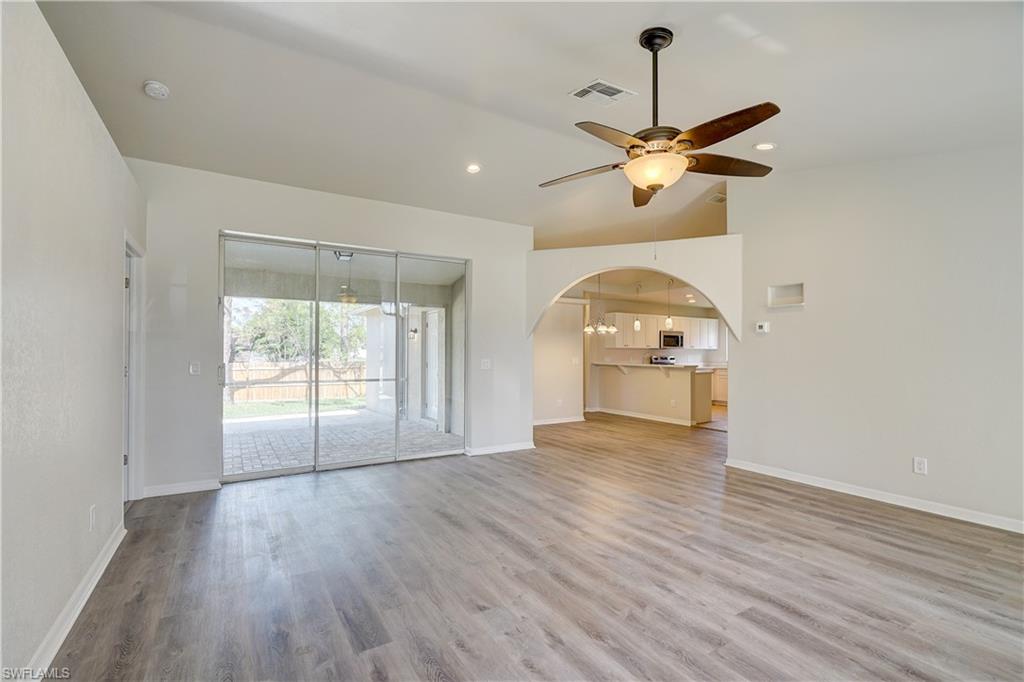 8381 Blackberry Road Fort Myers, FL 33967 - Photo 10 of 36 Unfurnished living room featuring ceiling fan and light wood-type flooring