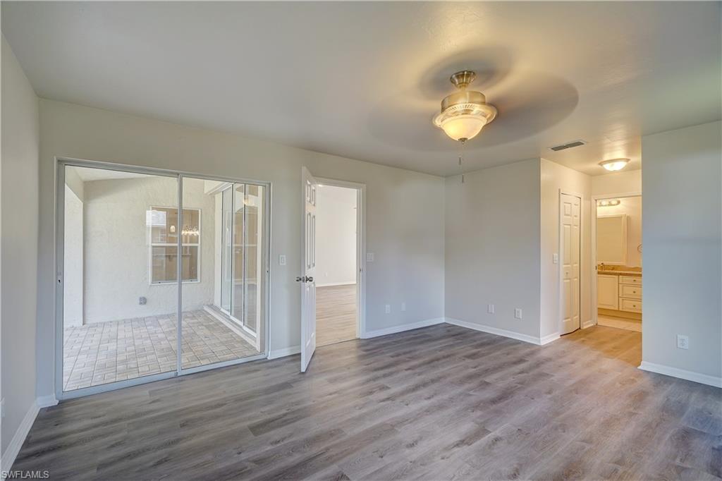 8381 Blackberry Road Fort Myers, FL 33967 - Photo 16 of 36 Unfurnished room featuring ceiling fan and light hardwood / wood-style flooring