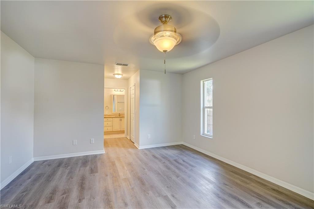8381 Blackberry Road Fort Myers, FL 33967 - Photo 17 of 36 Empty room featuring light hardwood / wood-style floors and ceiling fan
