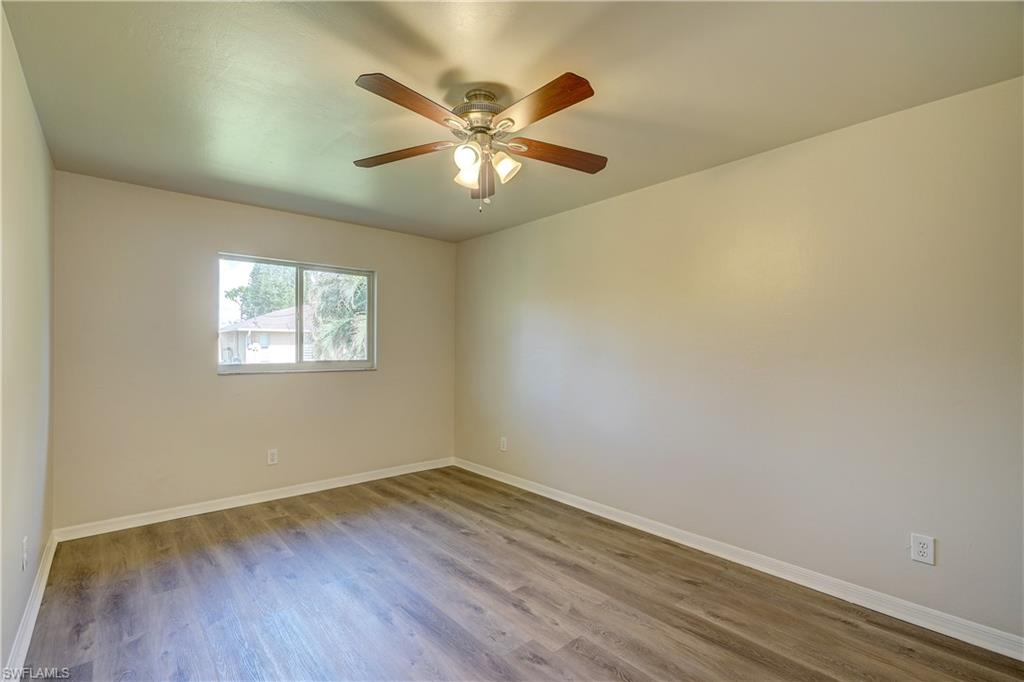 8381 Blackberry Road Fort Myers, FL 33967 - Photo 19 of 36 Unfurnished room with hardwood / wood-style flooring and ceiling fan
