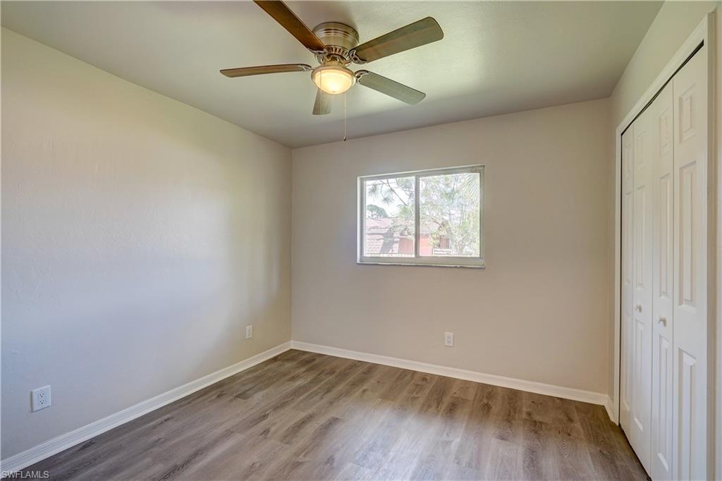 8381 Blackberry Road Fort Myers, FL 33967 - Photo 21 of 36 Unfurnished bedroom with light hardwood / wood-style flooring, a closet, and ceiling fan