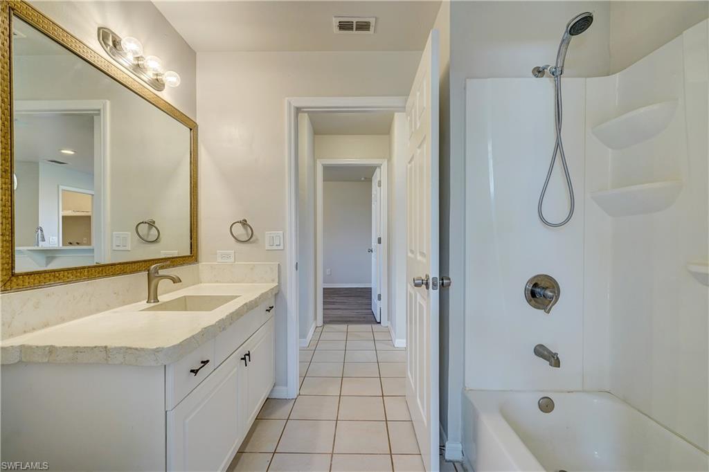 8381 Blackberry Road Fort Myers, FL 33967 - Photo 22 of 36 Bathroom with vanity, tile patterned floors, and shower / bathtub combination