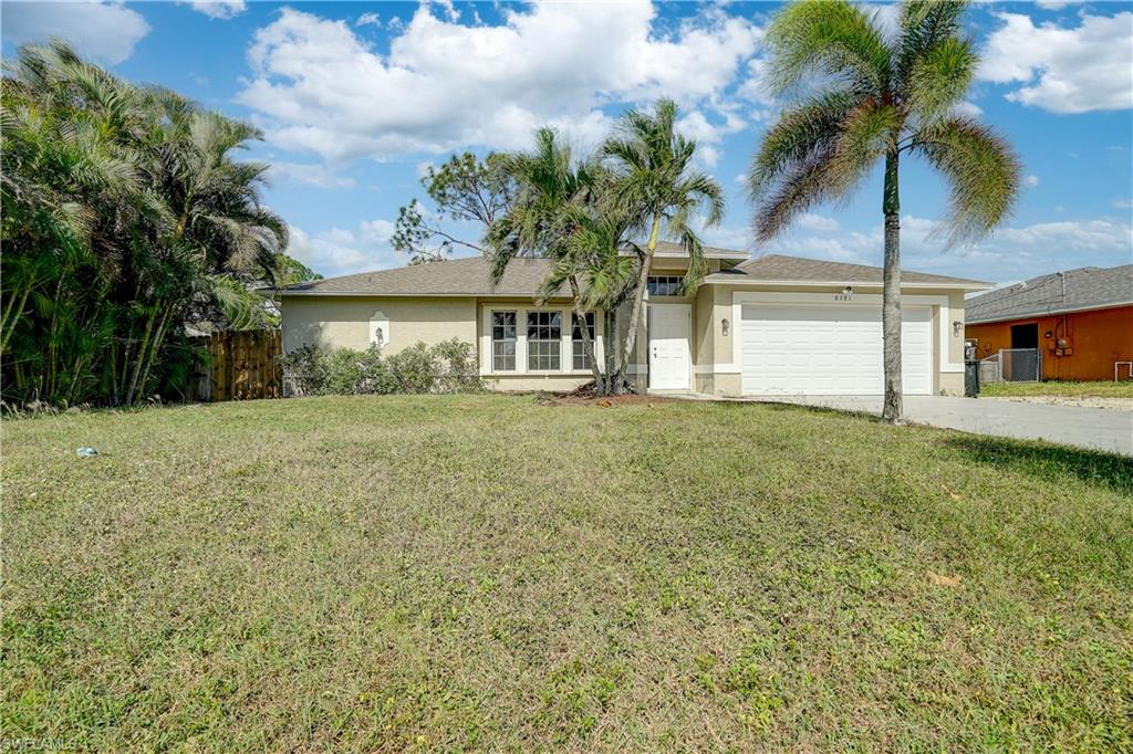 8381 Blackberry Road Fort Myers, FL 33967 - Photo 30 of 36 Ranch-style home with central air condition unit, a front lawn, and a garage