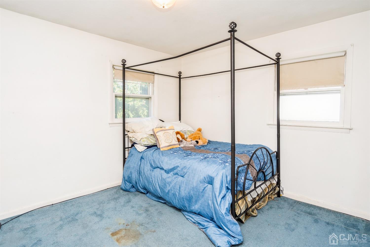 32 Idlewild Road Edison, NJ 08817 - Photo 12 of 14 a bedroom with a bed next to a window