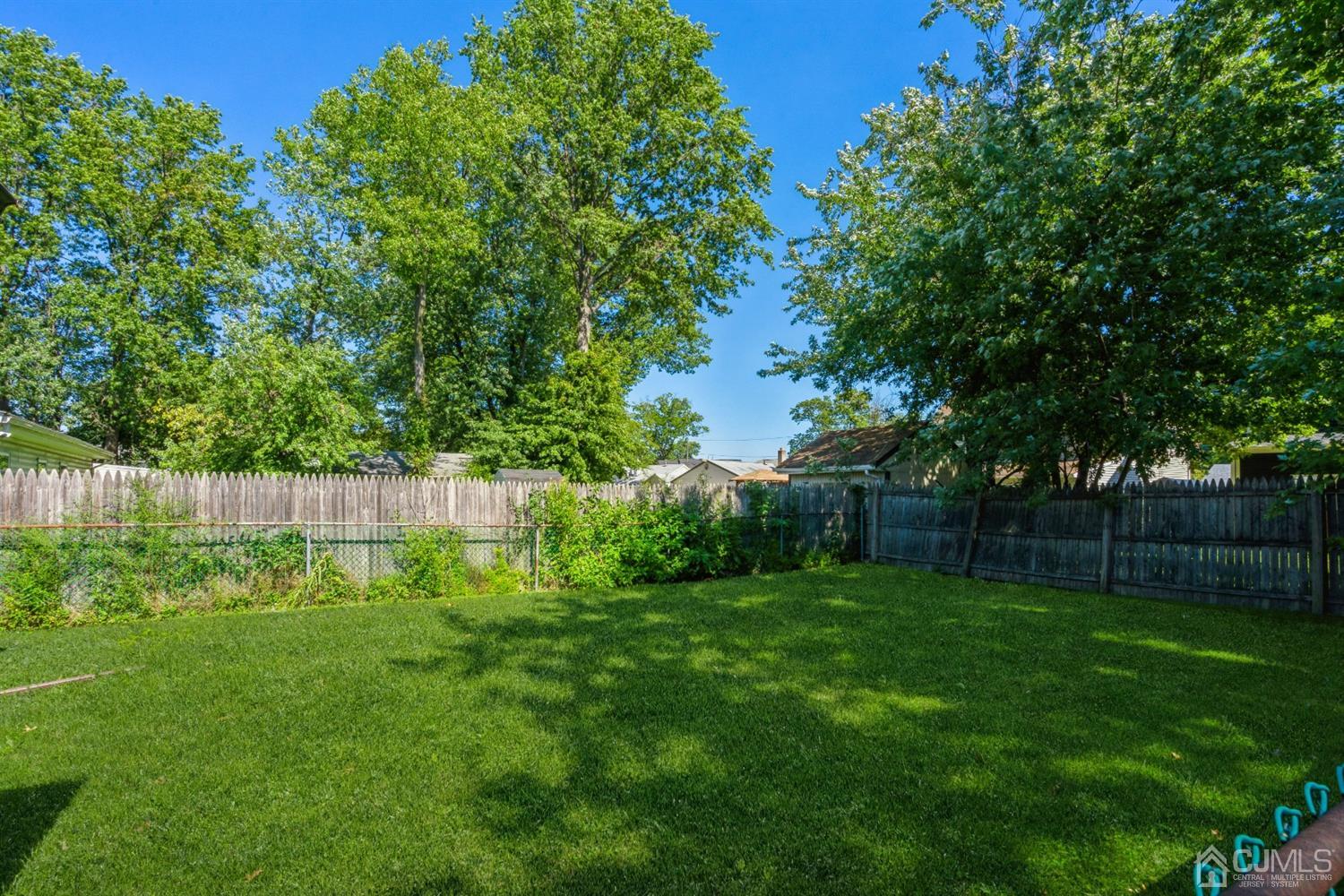 32 Idlewild Road Edison, NJ 08817 - Photo 14 of 14 a view of a backyard with a plants and trees