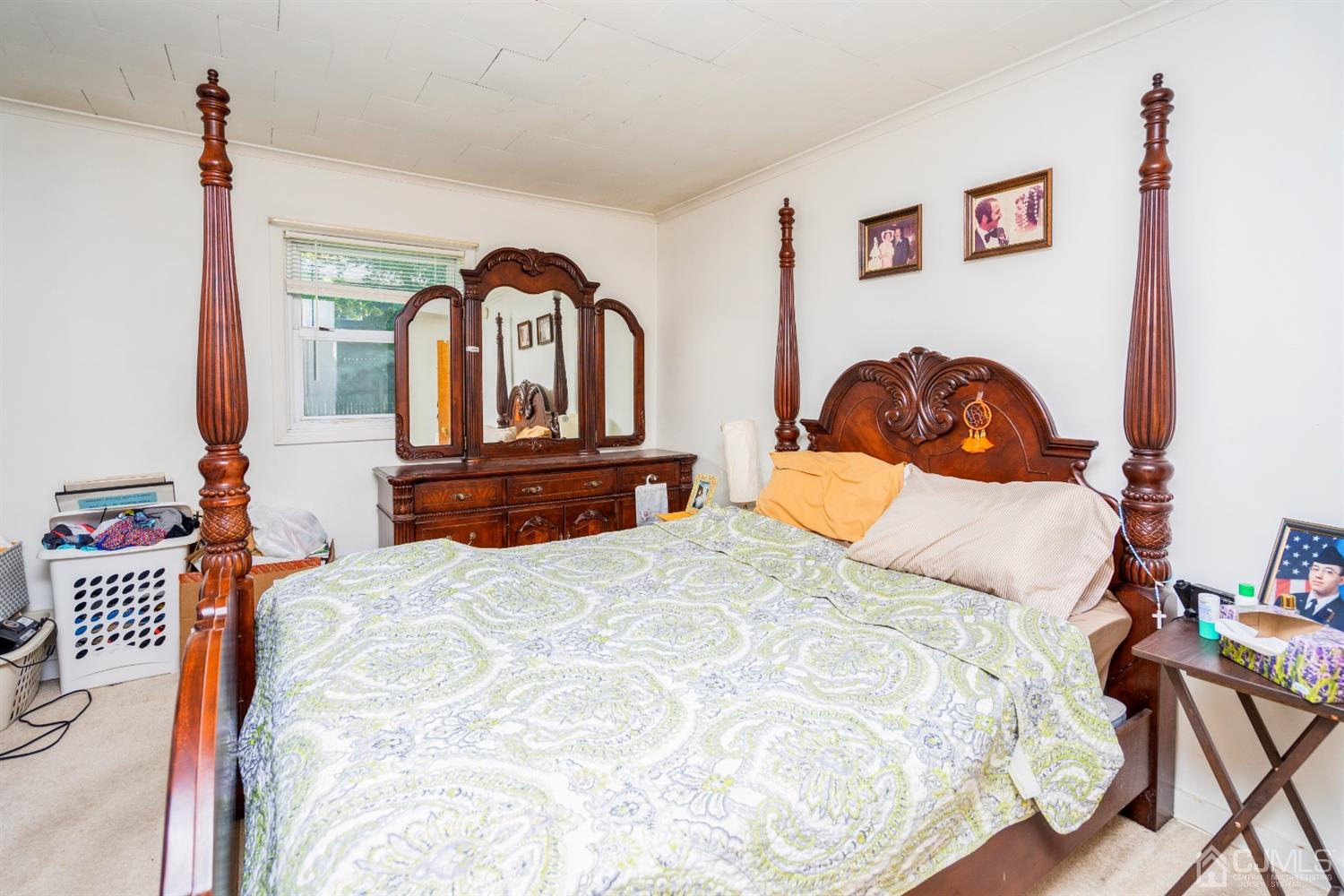 32 Idlewild Road Edison, NJ 08817 - Photo 10 of 14 a bedroom with a bed and a painting on the wall