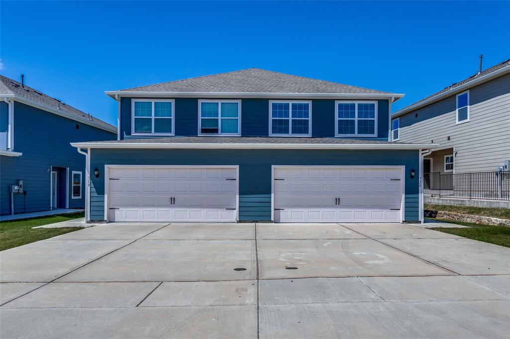 a front view of a house with a garage