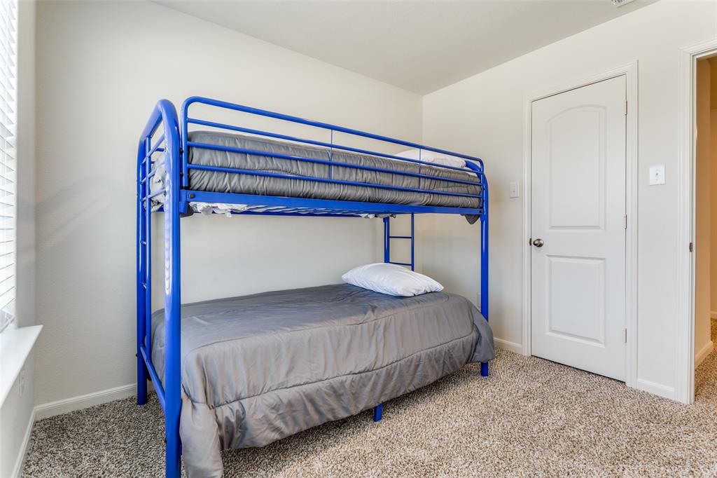 320 Stone Court Princeton, TX 75407 - Photo 11 of 15 a bedroom with a bed and a window