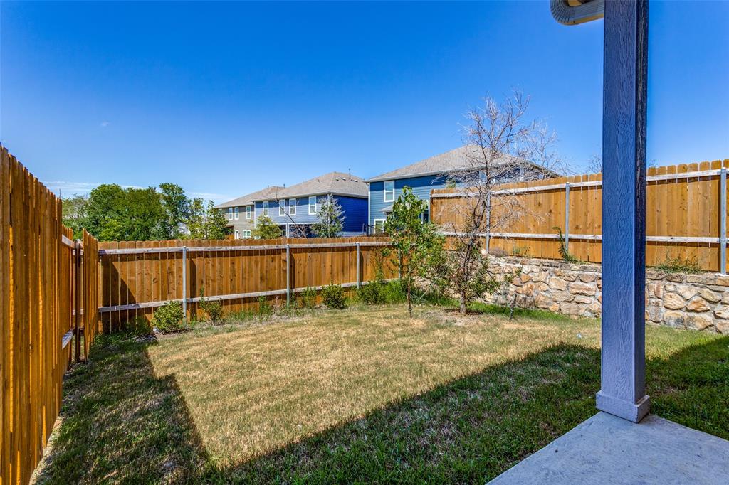 320 Stone Court Princeton, TX 75407 - Photo 13 of 15 a view of a backyard with a garden
