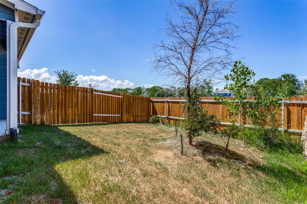 320 Stone Court Princeton, TX 75407 - Photo 14 of 15 a backyard of a house with lots of green space