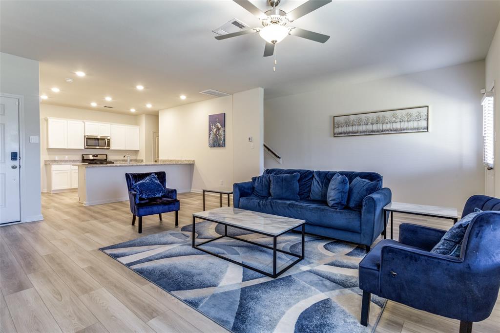 320 Stone Court Princeton, TX 75407 - Photo 7 of 15 a living room with furniture and wooden floor