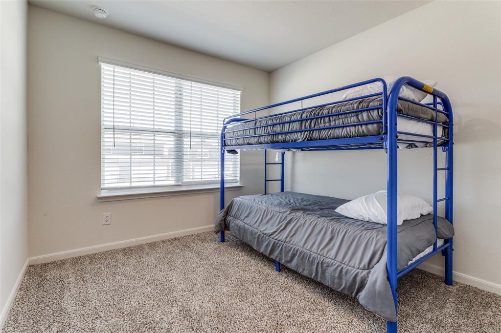 320 Stone Court Princeton, TX 75407 - Photo 10 of 15 a bedroom with a bed and a window