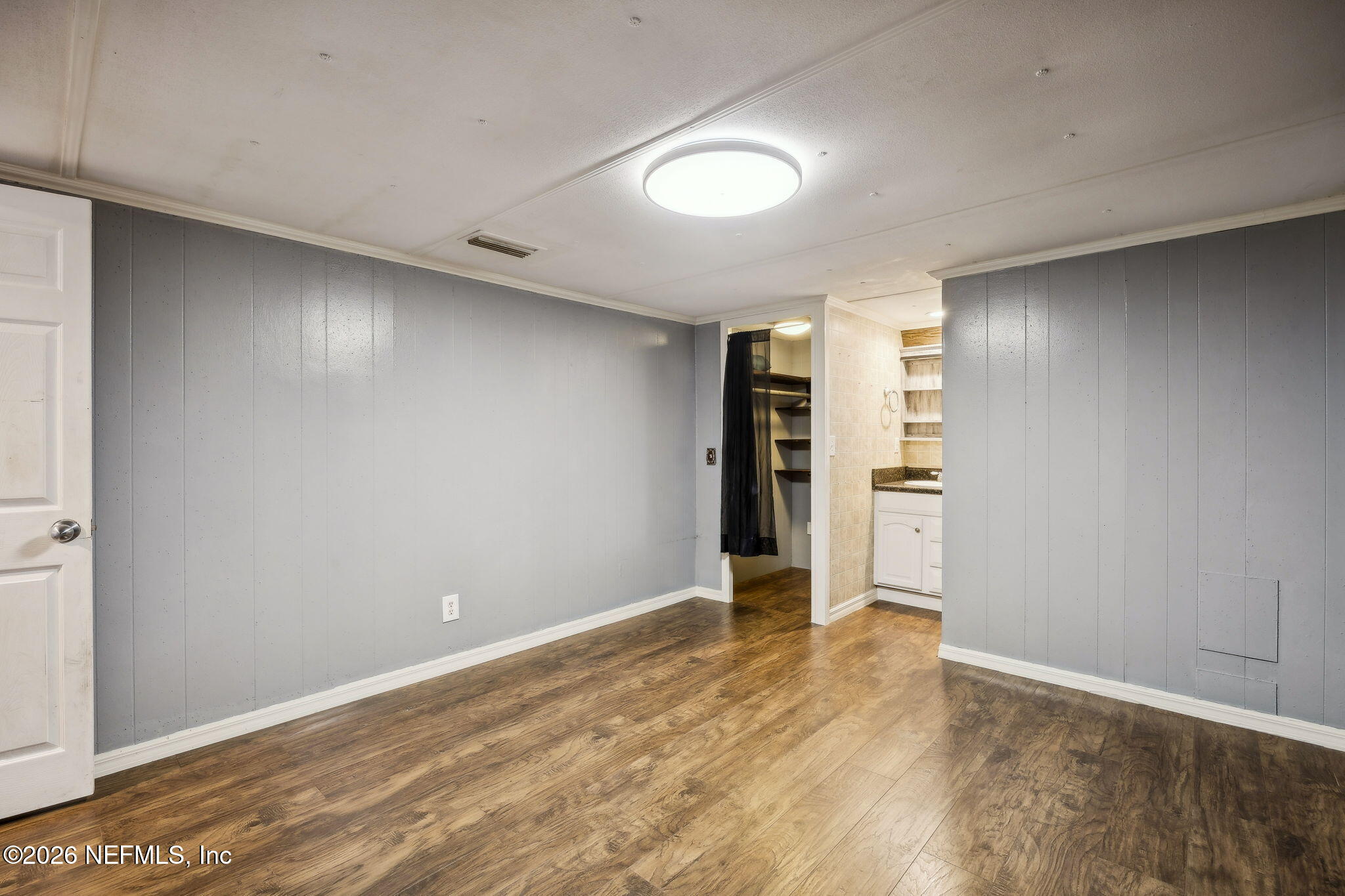 8117 Northwest County Road, Unit 225 Raiford, FL 32083 - Photo 19 of 38 a view of empty room with wooden floor