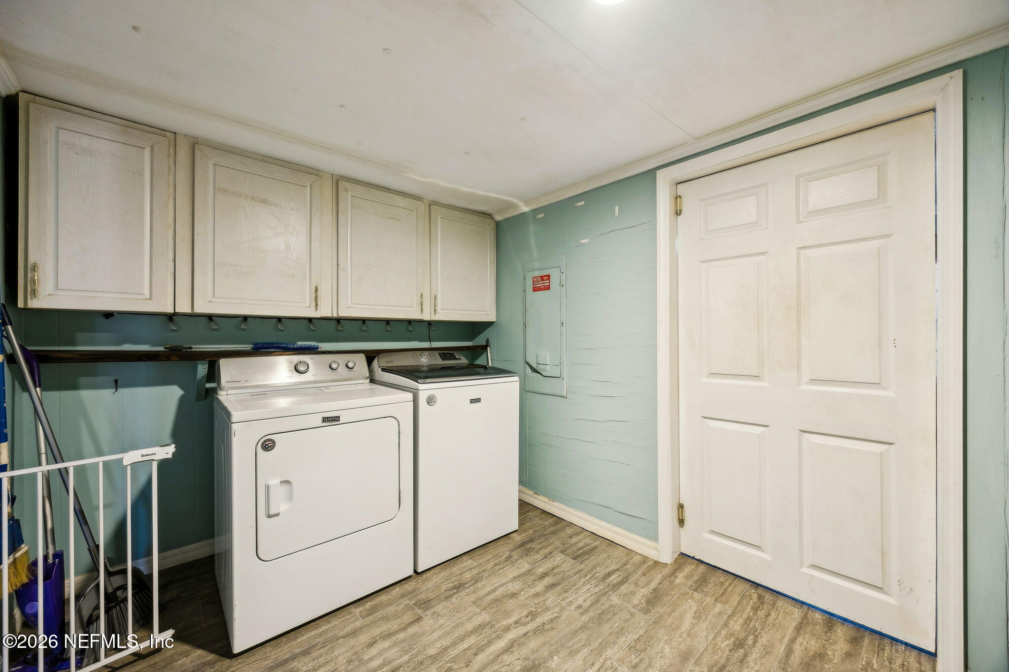 8117 Northwest County Road, Unit 225 Raiford, FL 32083 - Photo 24 of 38 a view of a storage & utility room with wooden floor