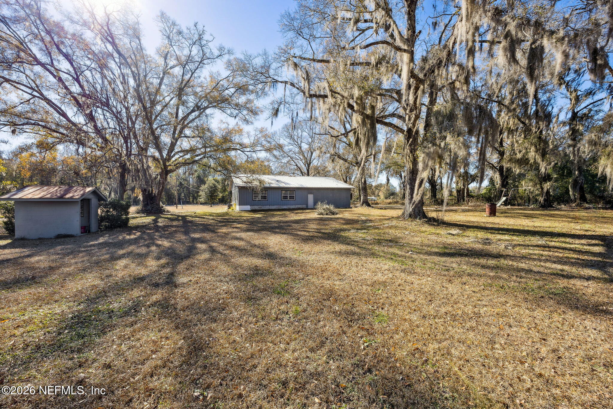 8117 Northwest County Road, Unit 225 Raiford, FL 32083 - Photo 32 of 38 a view of outdoor space with trees