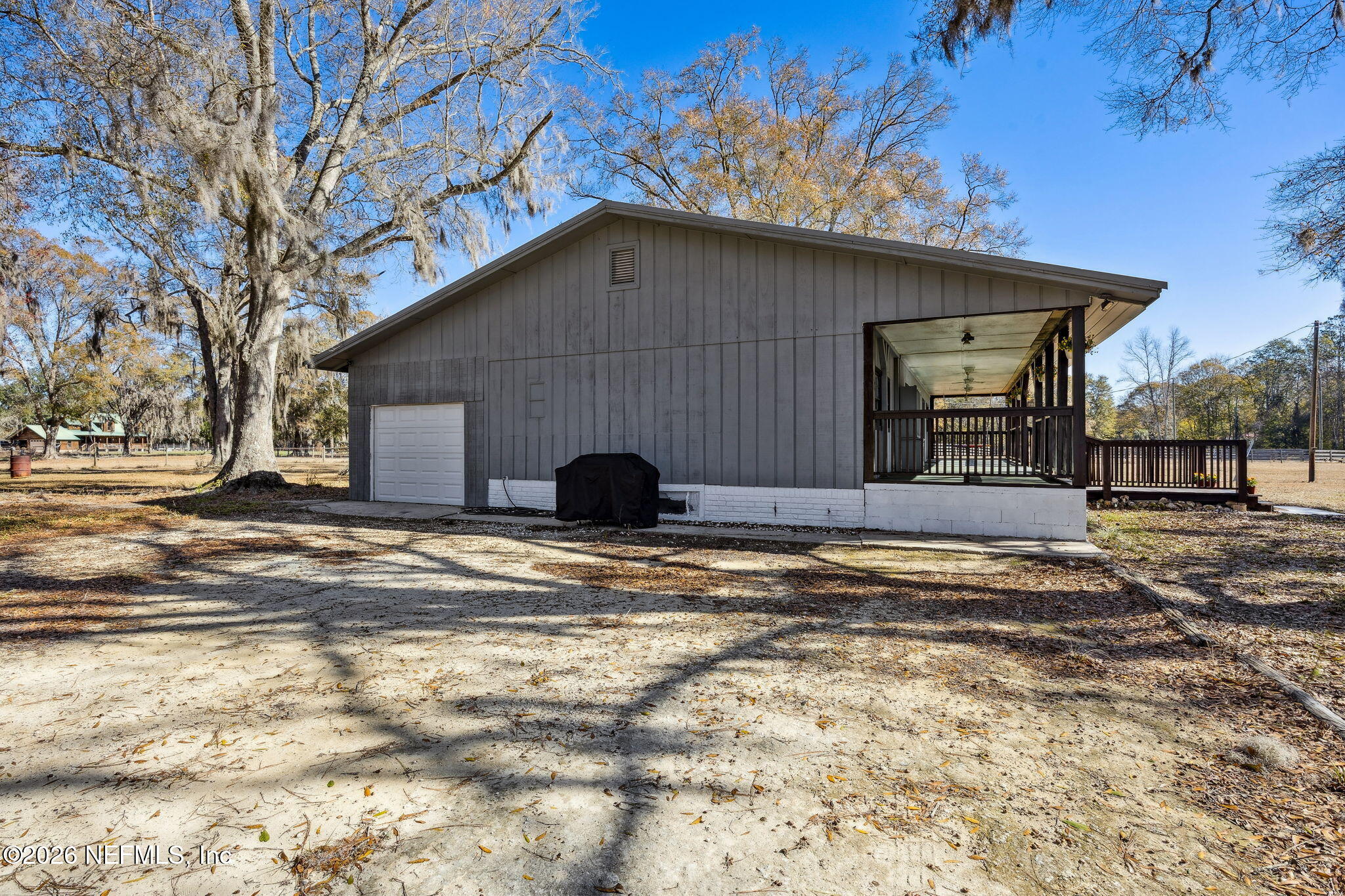 8117 Northwest County Road, Unit 225 Raiford, FL 32083 - Photo 36 of 38 a view of a house with a yard