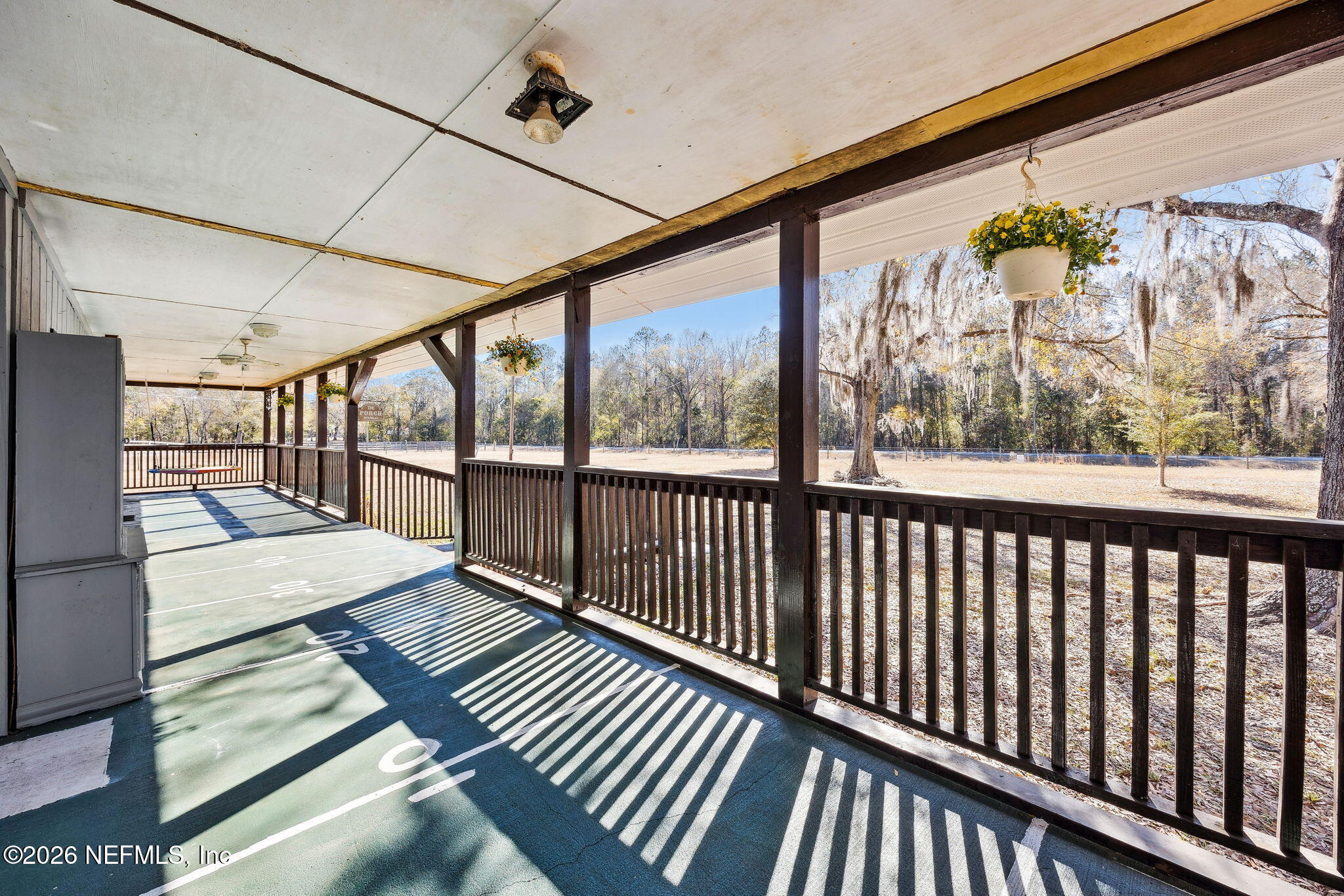 8117 Northwest County Road, Unit 225 Raiford, FL 32083 - Photo 5 of 38 a view of balcony with wooden floor