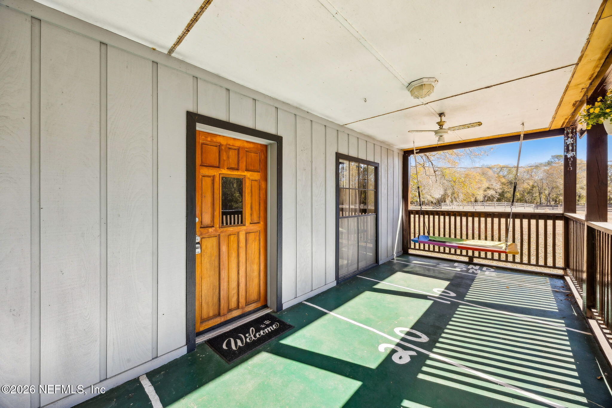 8117 Northwest County Road, Unit 225 Raiford, FL 32083 - Photo 7 of 38 a view of outdoor space with wooden floor and windows