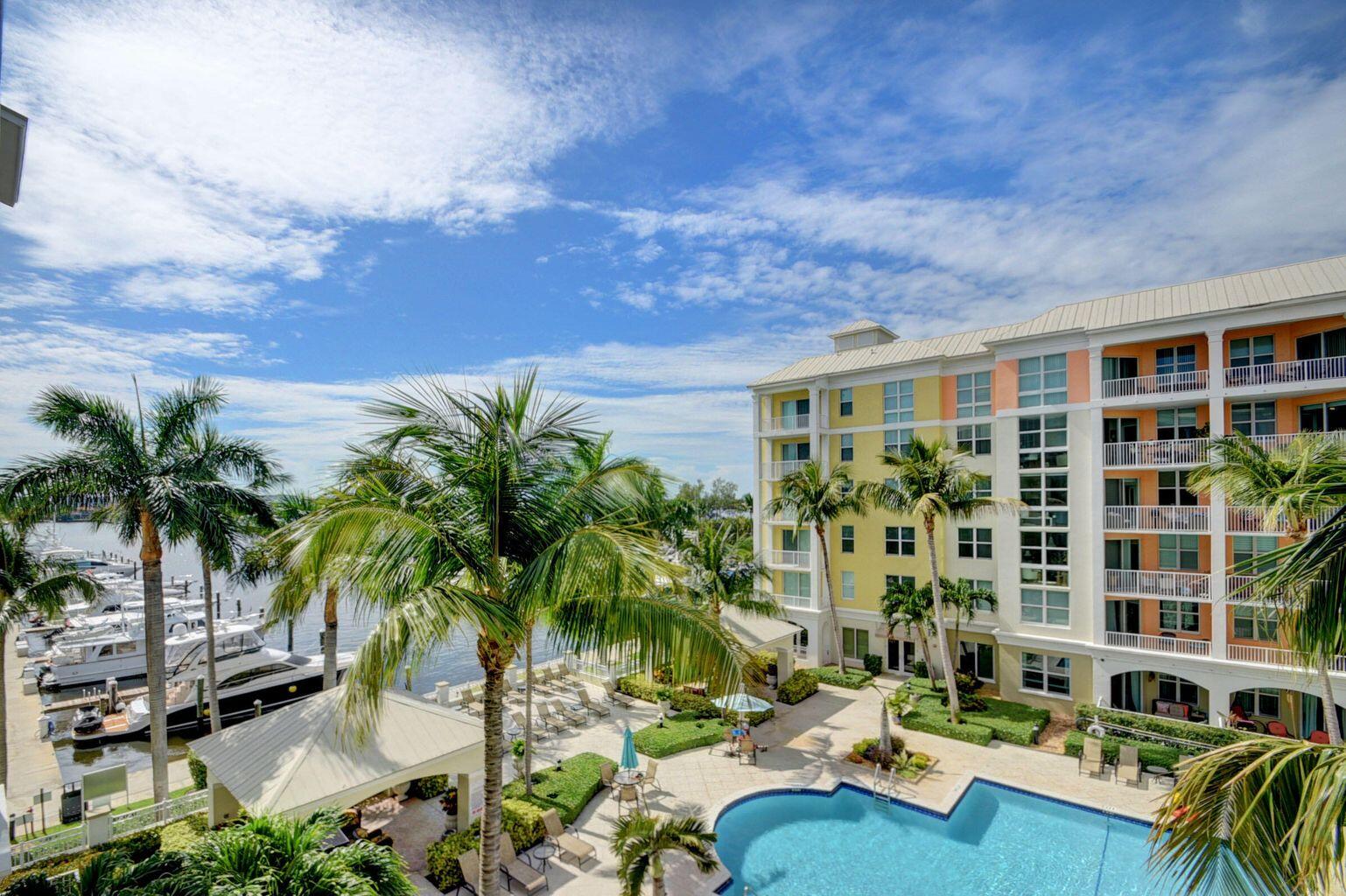 a view of multiple houses with a swimming pool