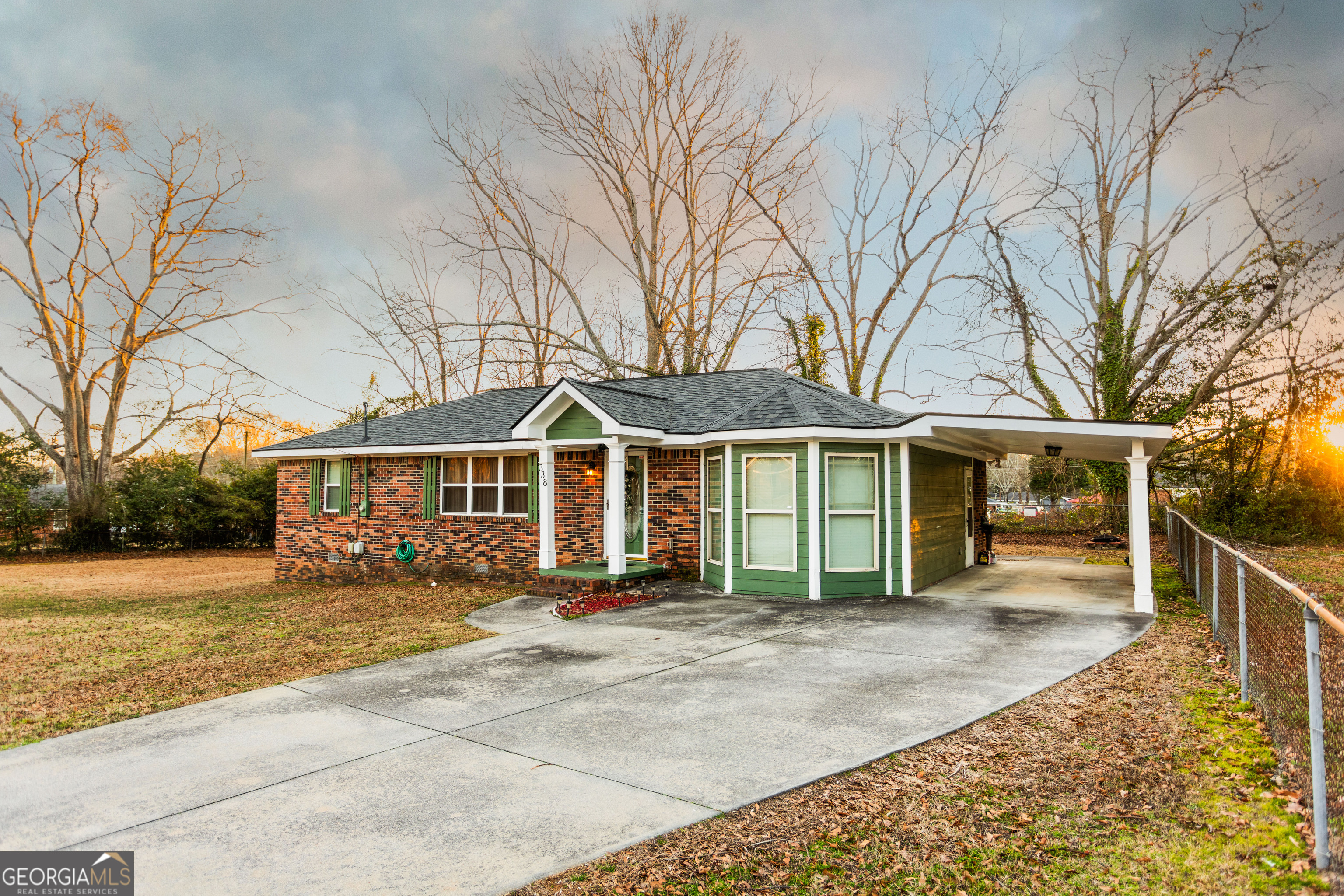 338 Boxwood Street Social Circle, GA 30025 - Photo 2 of 22 front view of a house with a yard