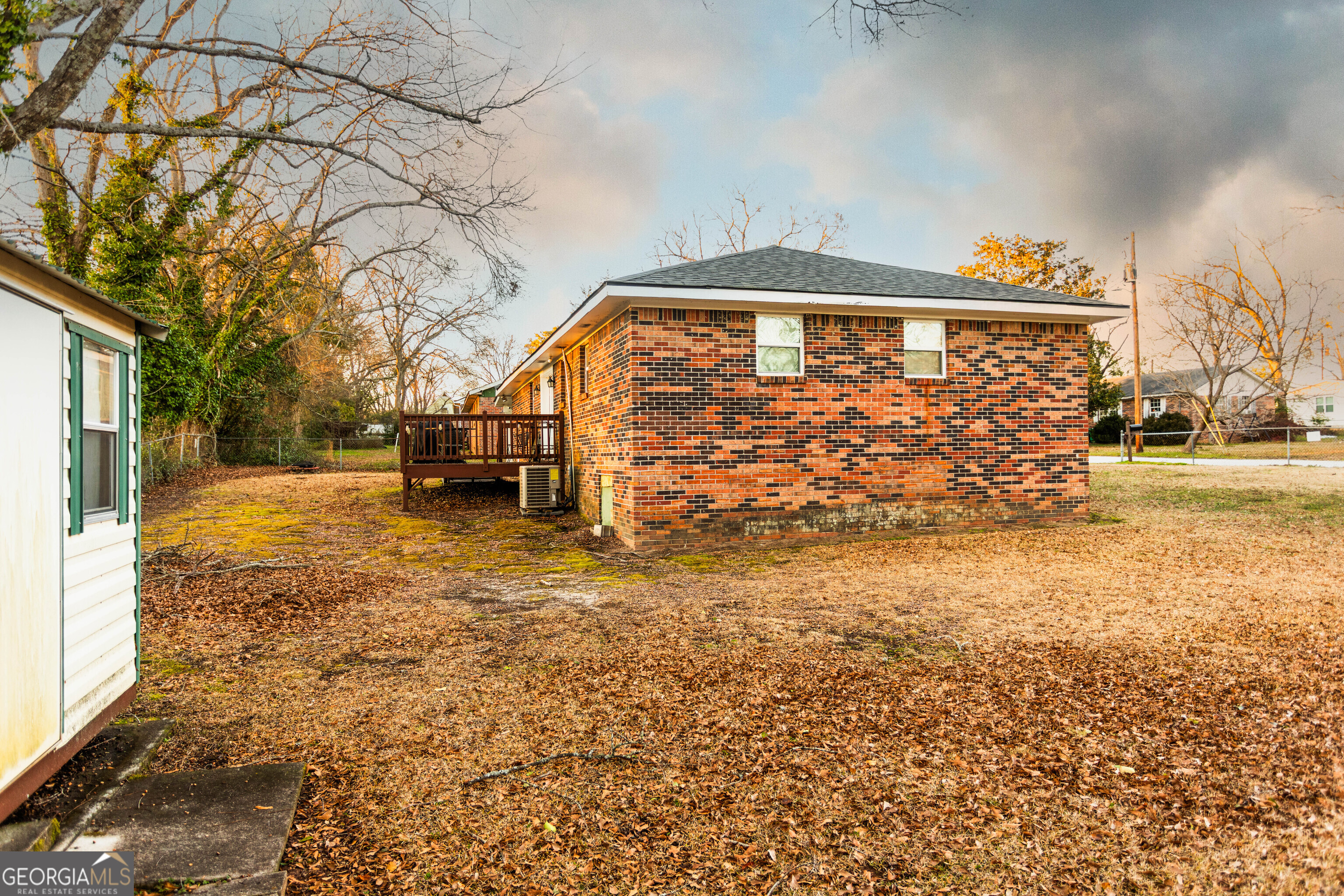 338 Boxwood Street Social Circle, GA 30025 - Photo 21 of 22 a front view of a house with a yard