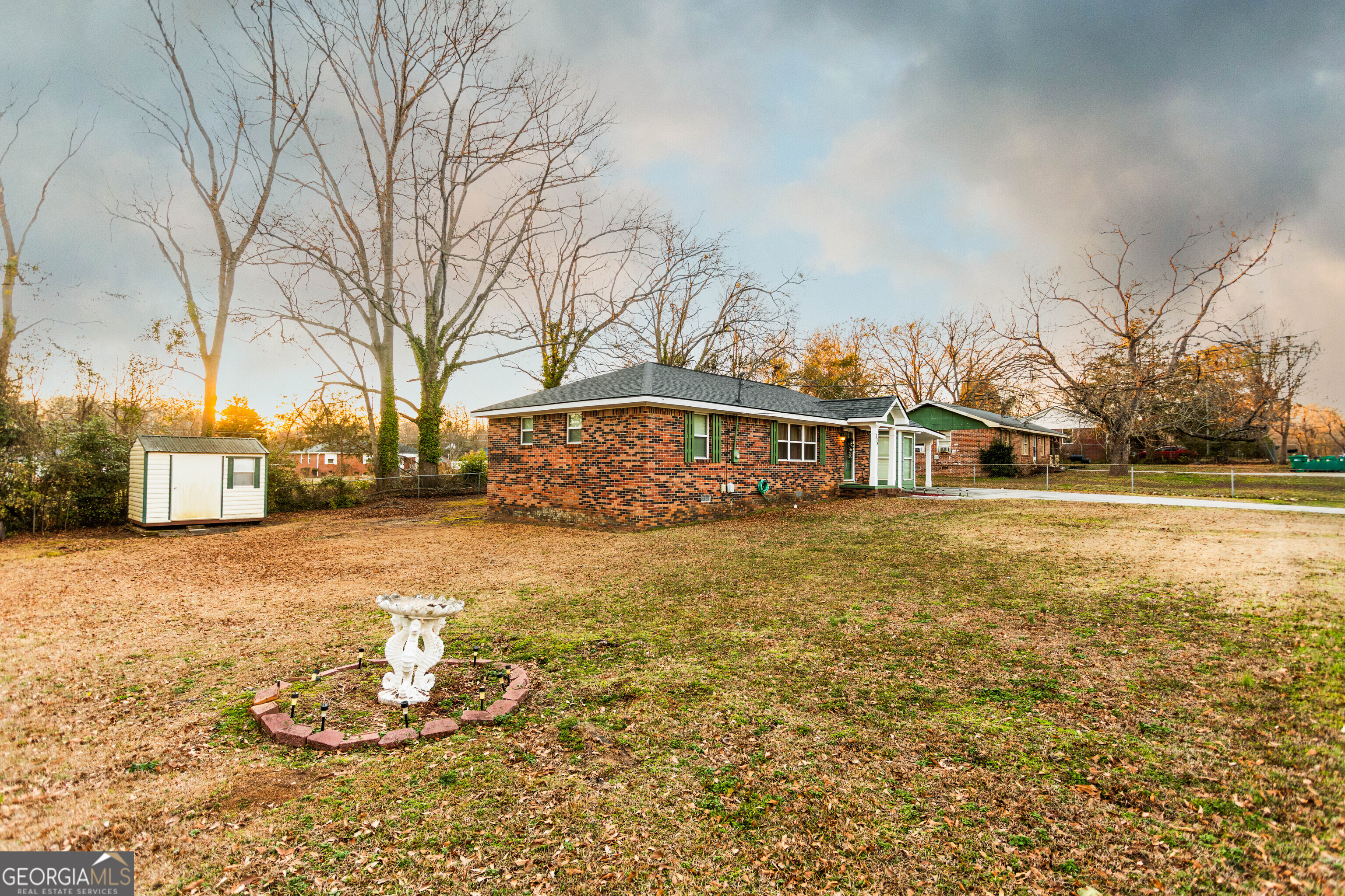 338 Boxwood Street Social Circle, GA 30025 - Photo 3 of 22 a view of a house with snow on the road