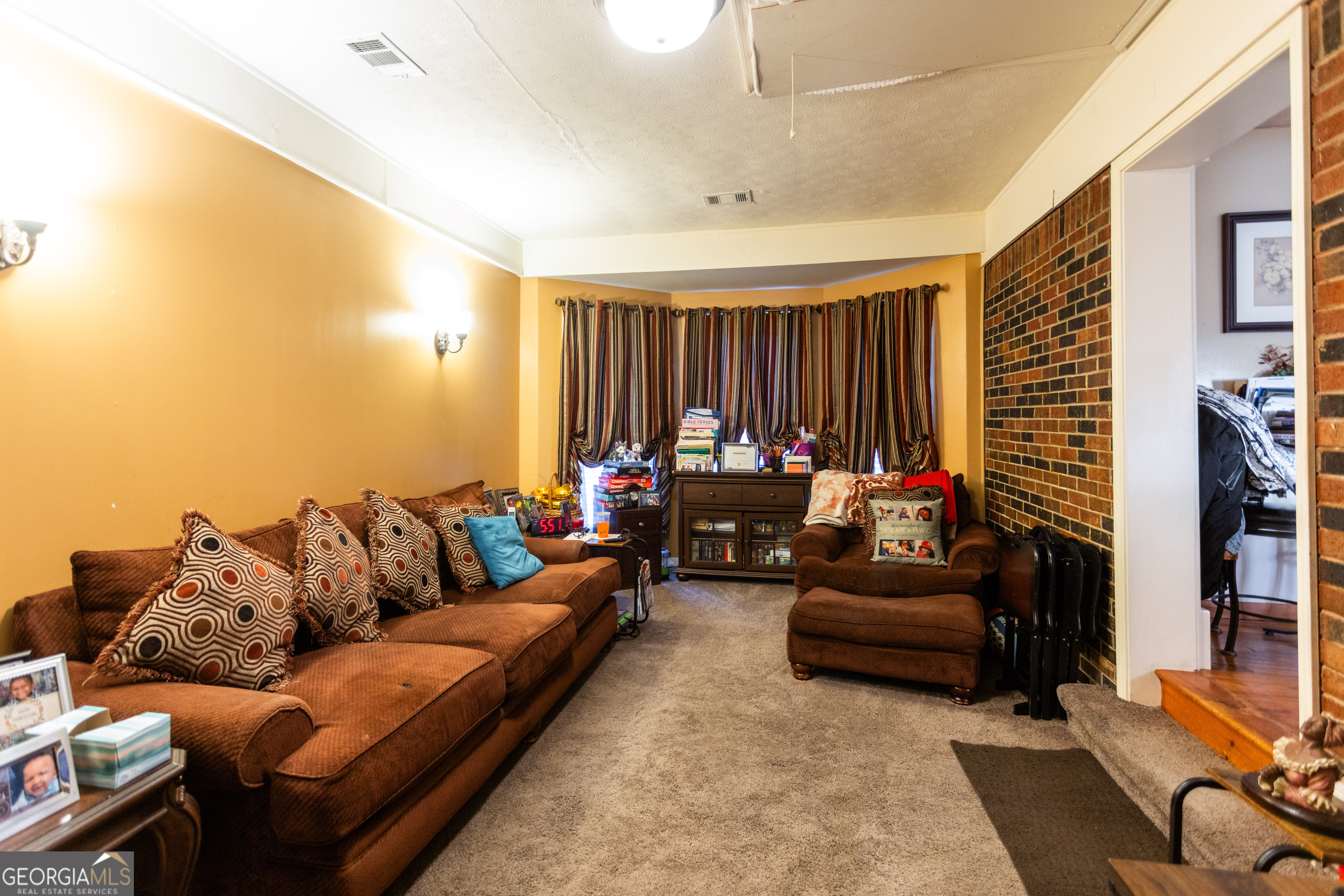 338 Boxwood Street Social Circle, GA 30025 - Photo 7 of 22 a living room with furniture and a window