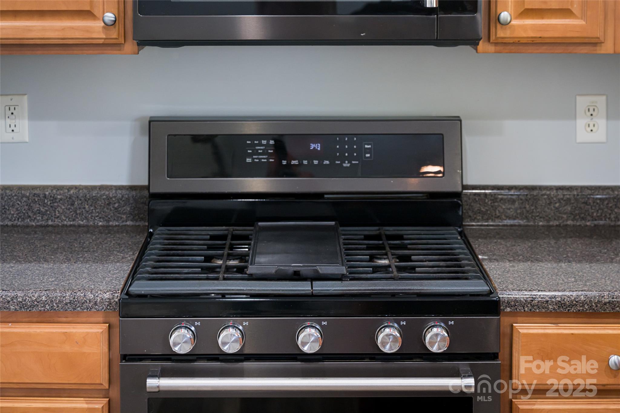 163 Yadkin Road Fletcher, NC 28732 - Photo 20 of 43 a close view of stove top oven