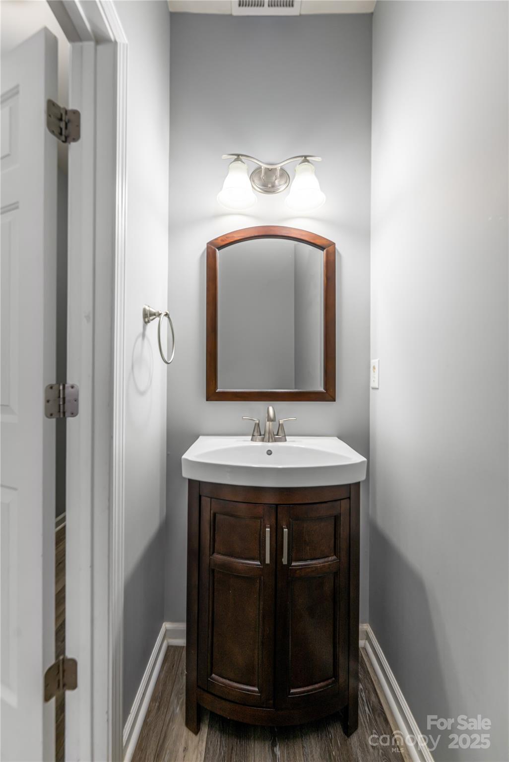 163 Yadkin Road Fletcher, NC 28732 - Photo 22 of 43 a bathroom with a sink and a mirror