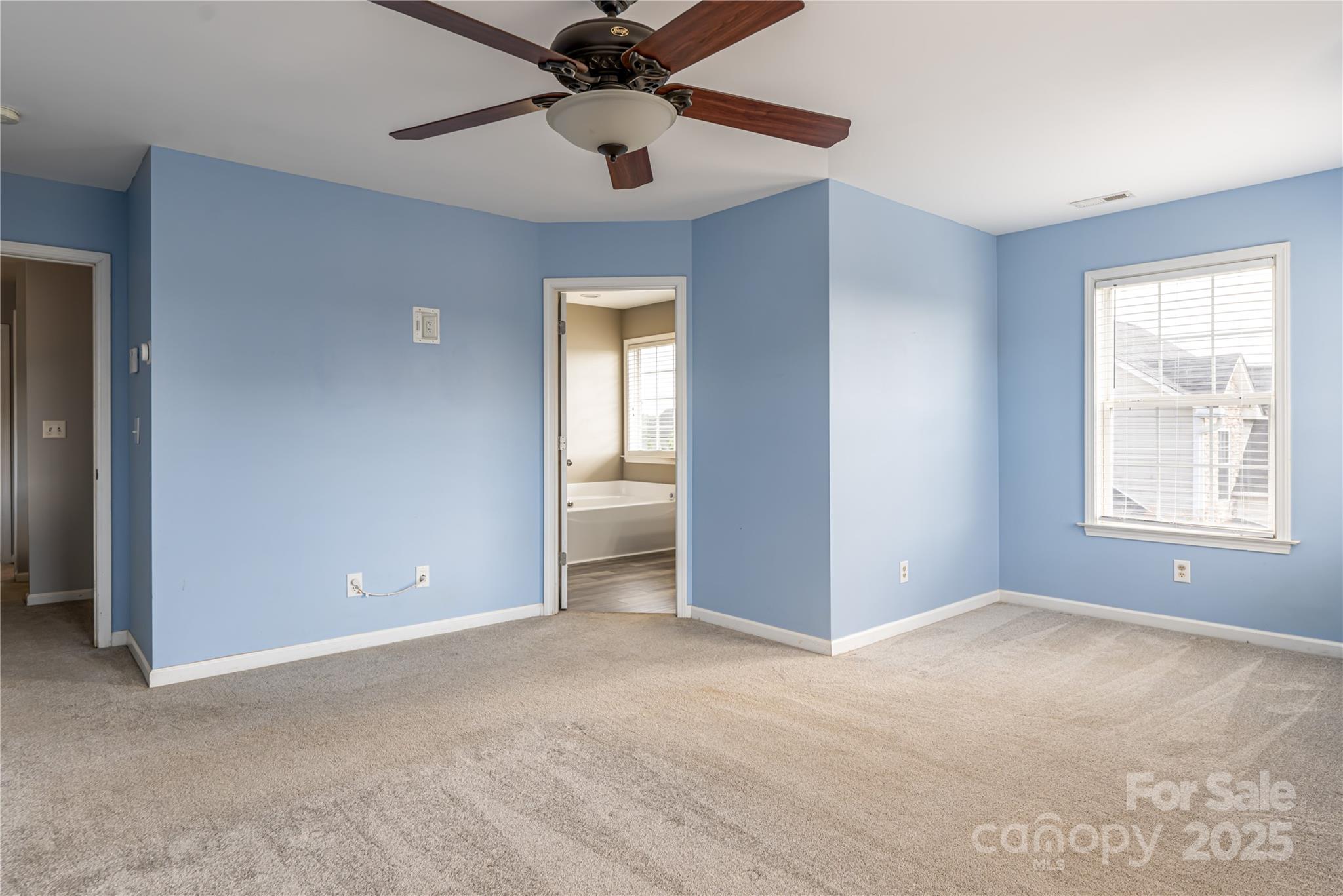 163 Yadkin Road Fletcher, NC 28732 - Photo 27 of 43 a view of an empty room with a window