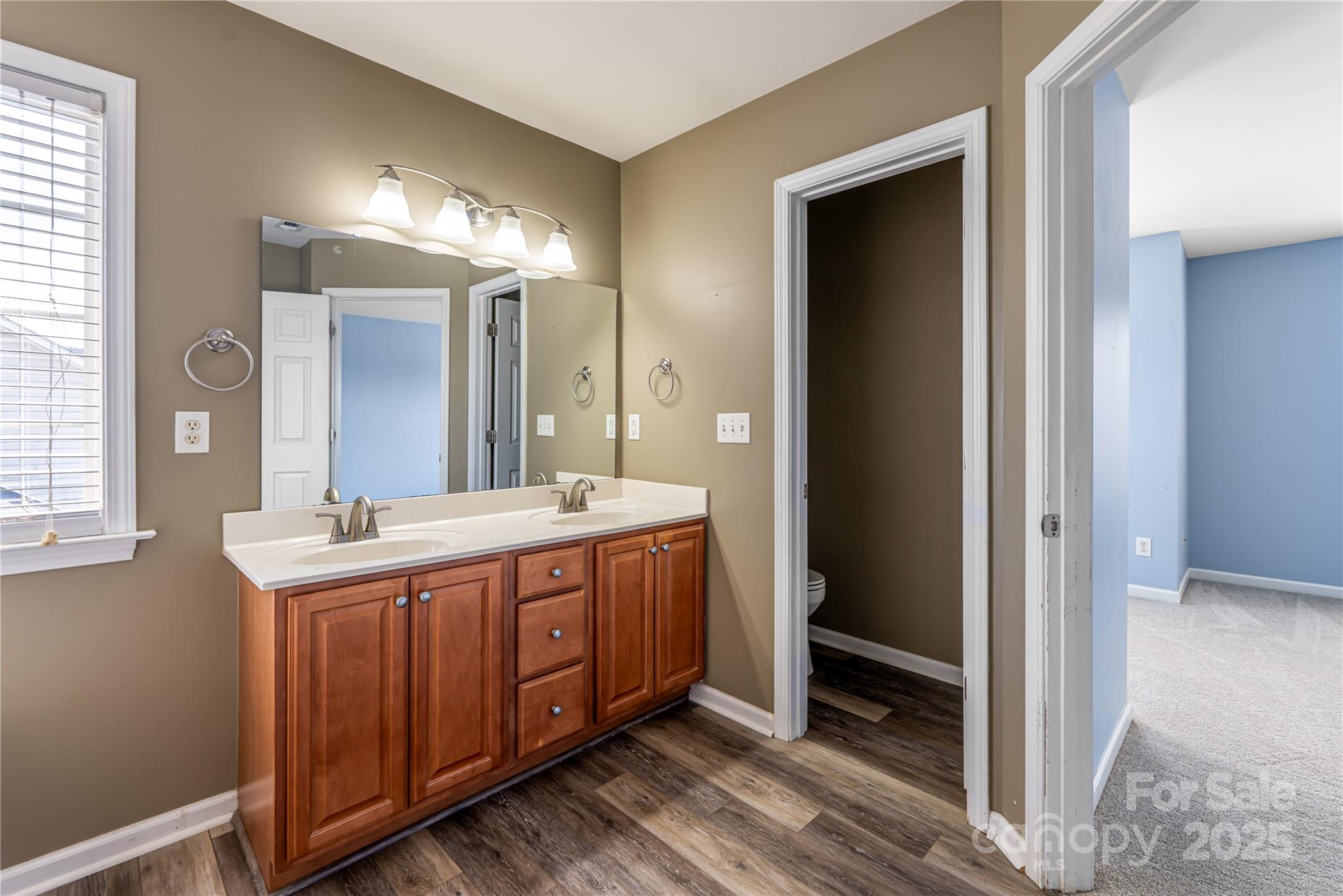 163 Yadkin Road Fletcher, NC 28732 - Photo 30 of 43 a spacious bathroom with a double vanity sink and a mirror