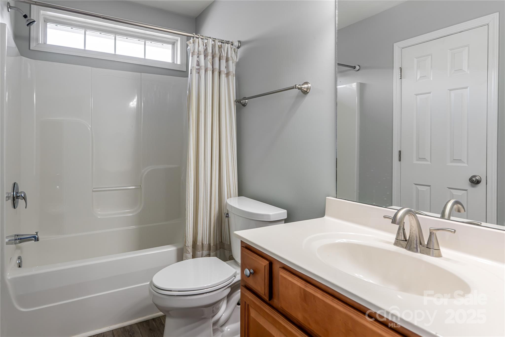 163 Yadkin Road Fletcher, NC 28732 - Photo 35 of 43 a bathroom with a sink toilet and shower