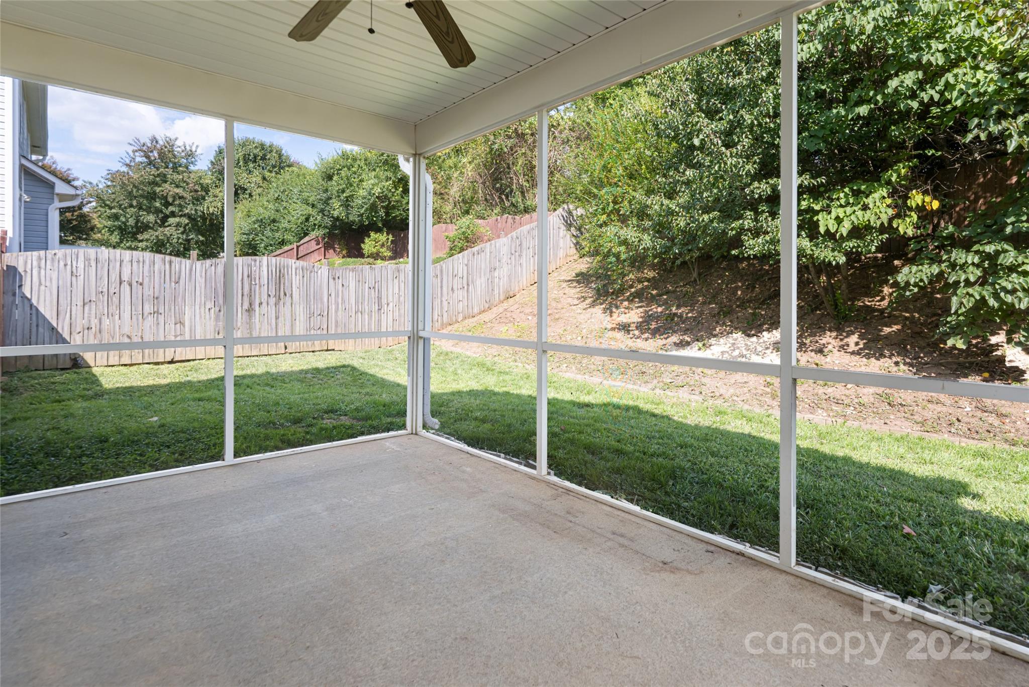 163 Yadkin Road Fletcher, NC 28732 - Photo 38 of 43 a view of a backyard with plants and garden view