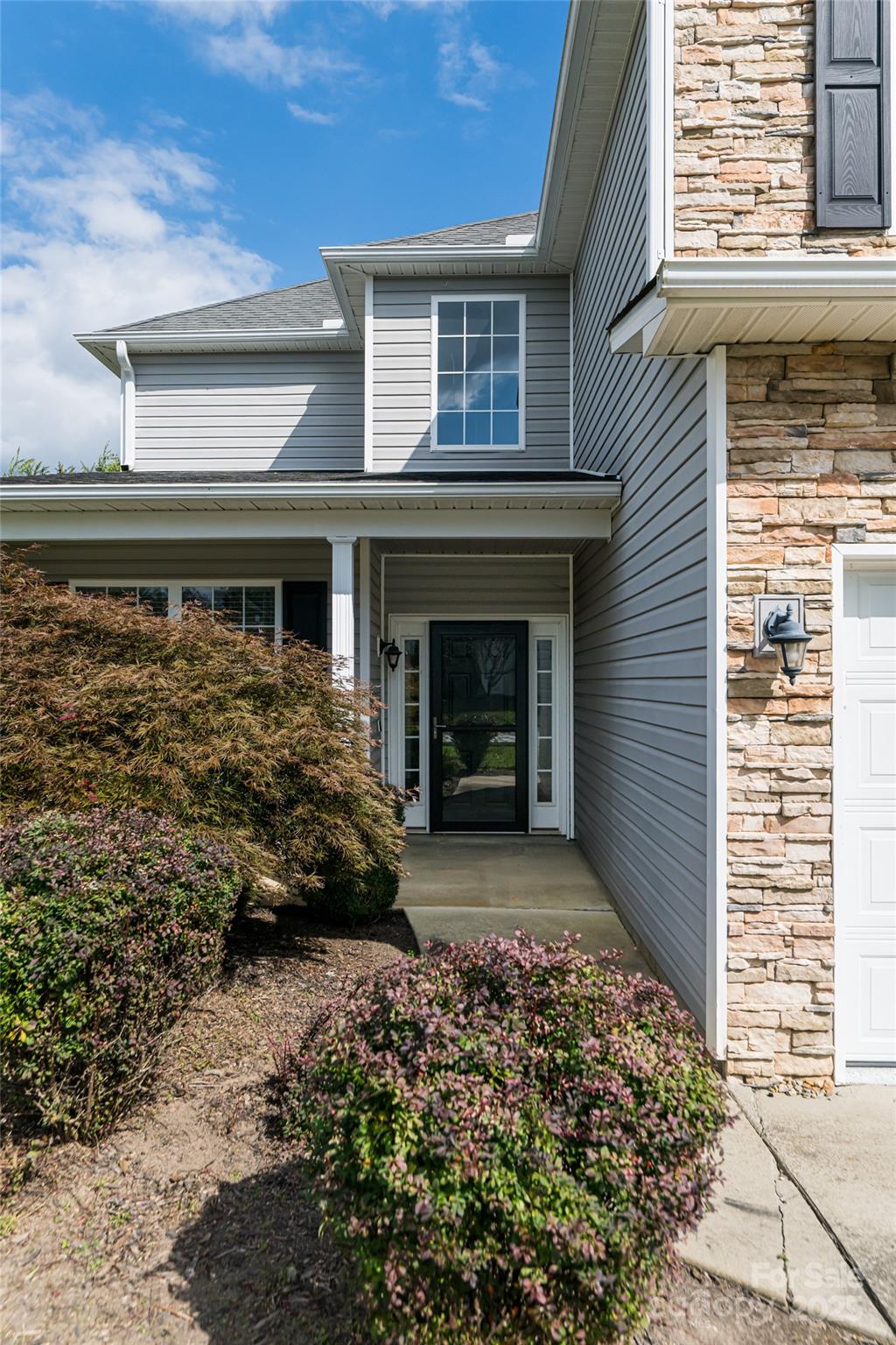 163 Yadkin Road Fletcher, NC 28732 - Photo 4 of 43 a front view of a house with garden