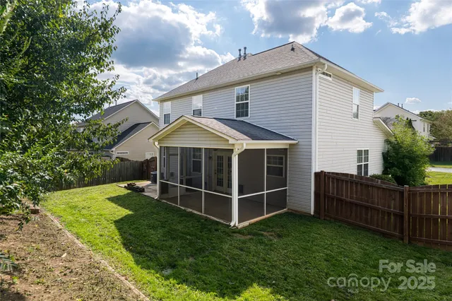 a view of a yard with a tree