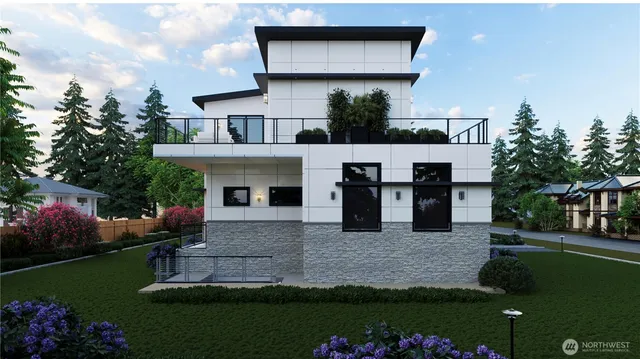 a front view of a house with a garden and yard