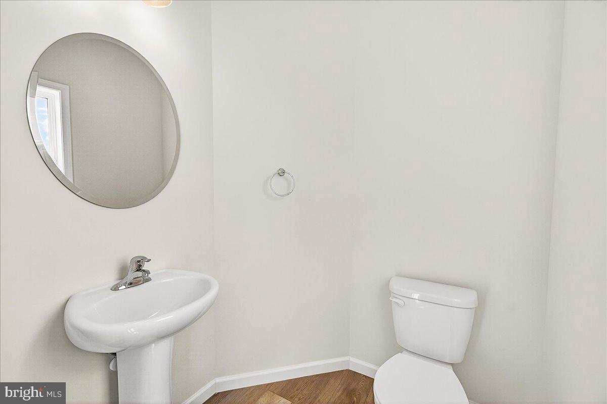 1600 Corn Crib Place Frederick, MD 21702 - Photo 13 of 38 a bathroom with a toilet sink and mirror