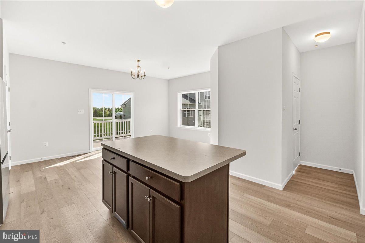 1600 Corn Crib Place Frederick, MD 21702 - Photo 15 of 38 a kitchen that has a sink and a wooden floor