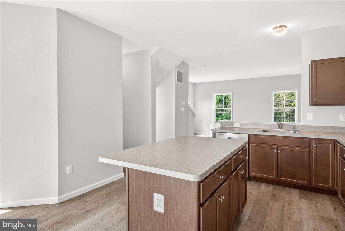 1600 Corn Crib Place Frederick, MD 21702 - Photo 16 of 38 a kitchen with a stove a sink and a refrigerator