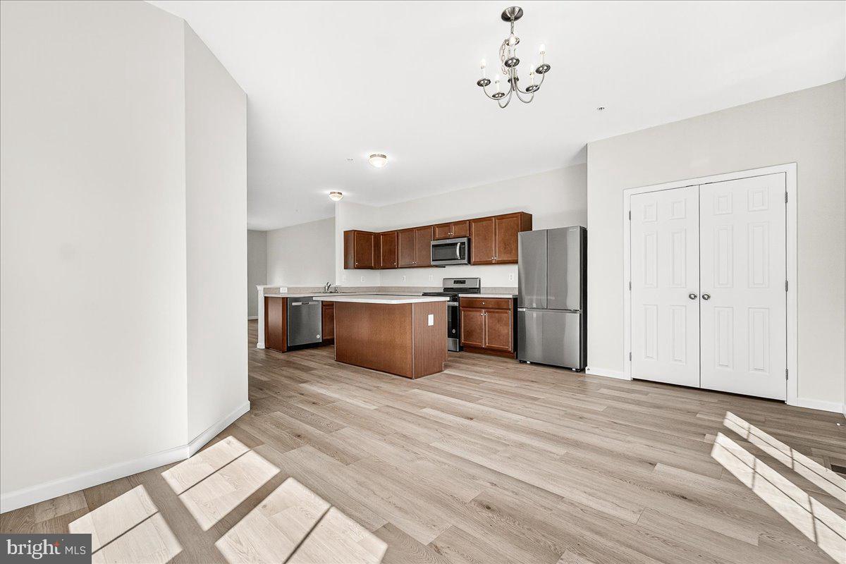 1600 Corn Crib Place Frederick, MD 21702 - Photo 21 of 38 a view of kitchen with wooden floor and electronic appliances